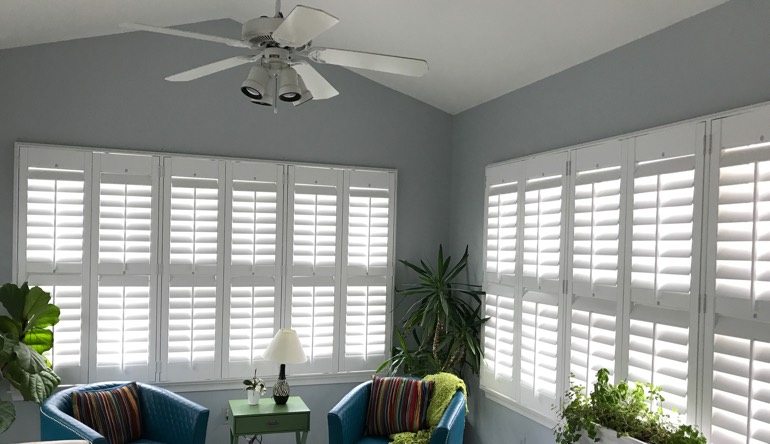 Tampa living room with fan and shutters